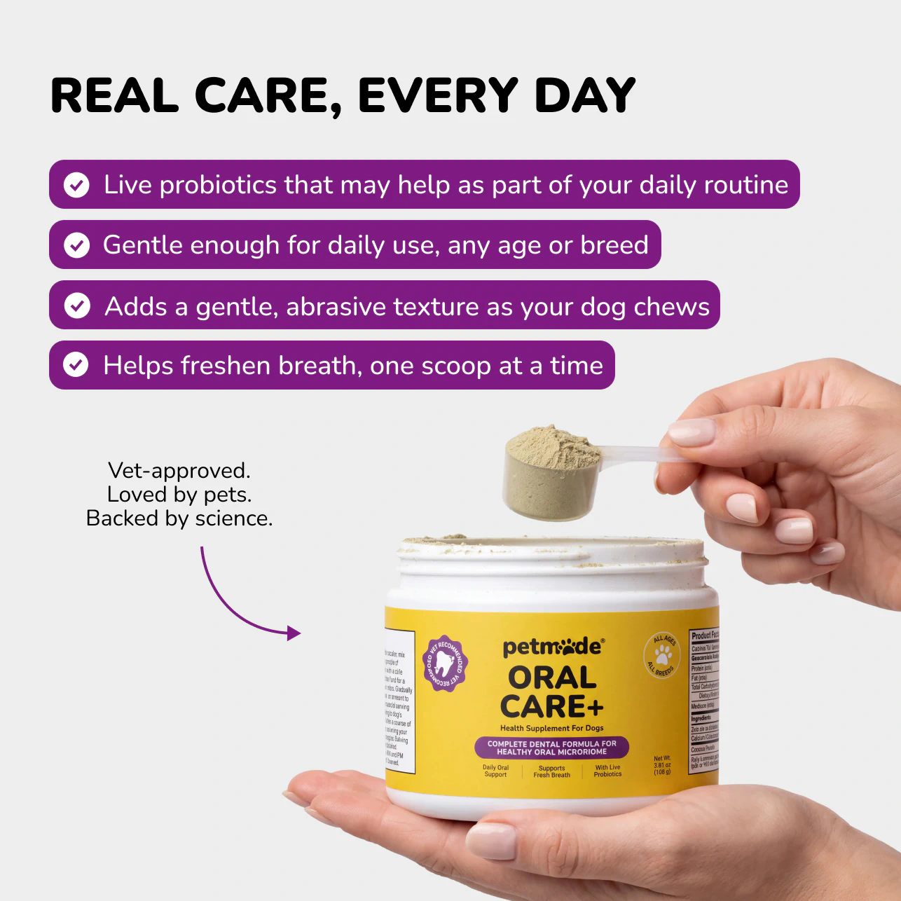 Hand holding a scoop of PetMade Oral Care+ powder